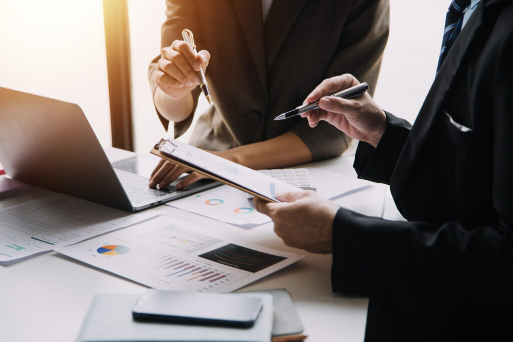 businesswoman or accountant working financial investment on calc